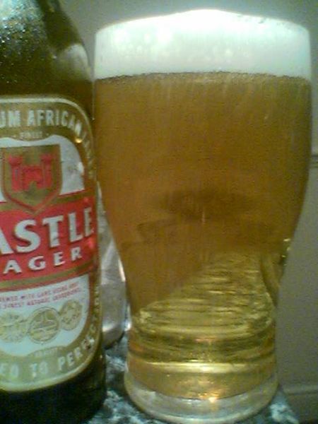 Castle Lager poured into a glass