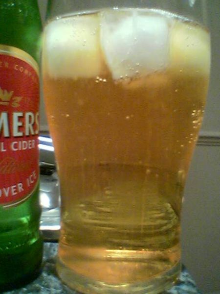 Gaymers Original Cider poured into a glass with ice